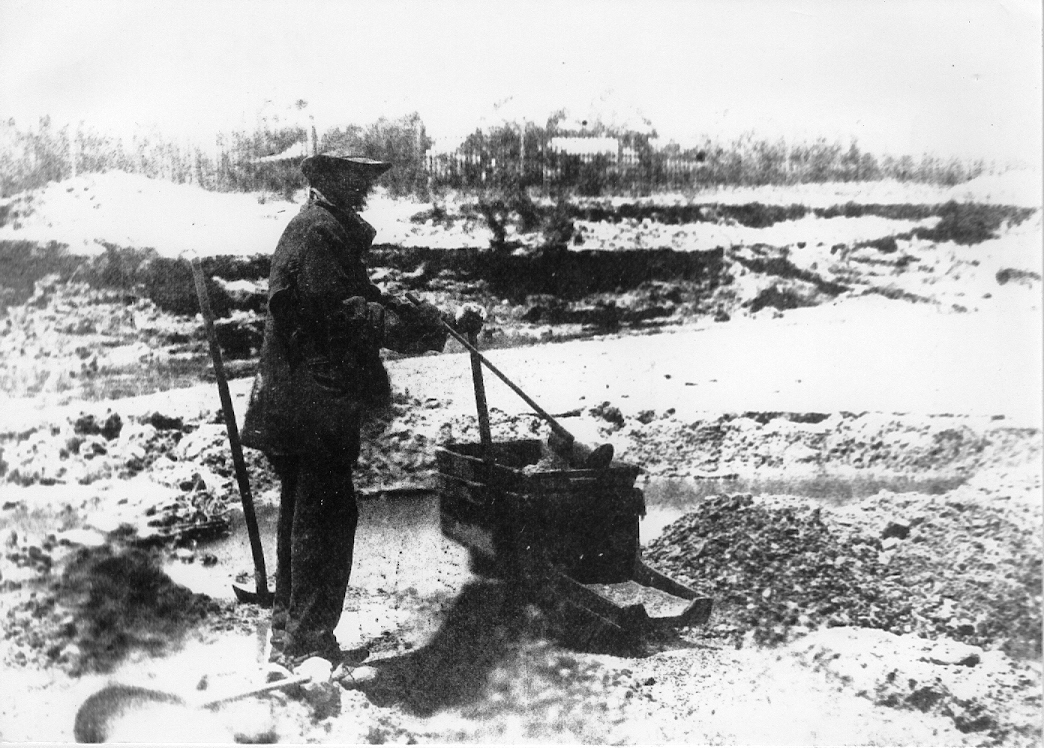 Gold mining using a traditional cradle High Country History Hub