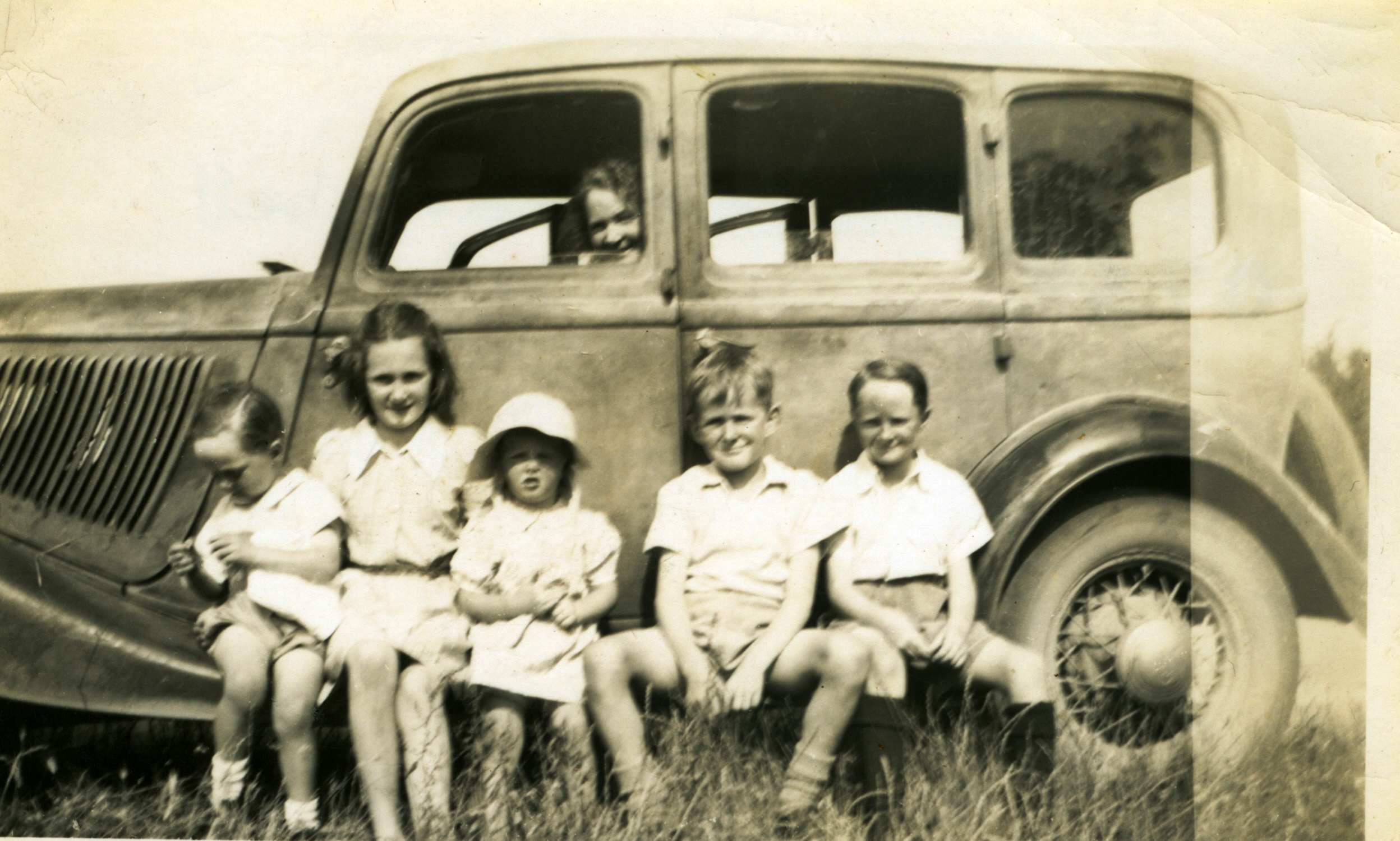 Mother Peg Martin in car. John, Margaret, Jean and Lindsay