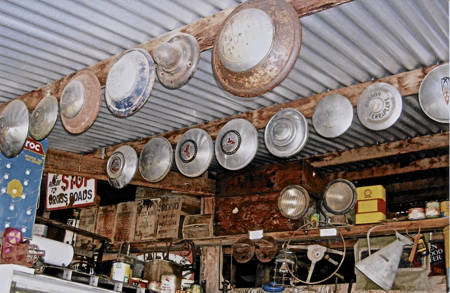 Ken Pollard Collection. Hubcaps & petrol containers High Country